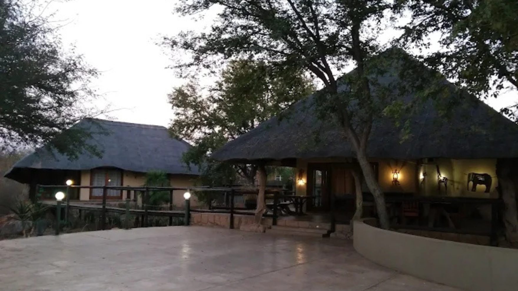 Lodge exterior at dusk with warm lights